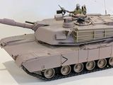 a toy tank that is sitting on a white surface