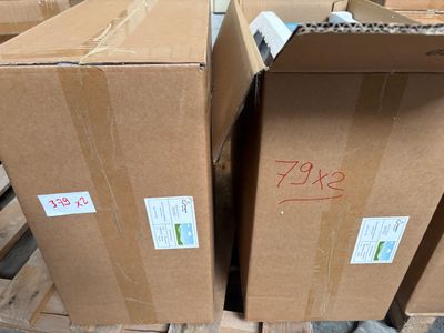 many boxes that are stacked on a pallet in a warehouse