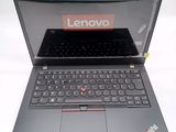 a laptop with a lenovo logo on the screen