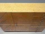 an image of a wooden cabinet with four drawers and two doors
