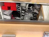 a drawer full of kitchen utensils and other items