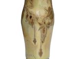 a vase that is sitting on a white surface