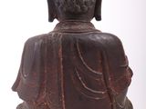 statue of a seated buddha on a white background