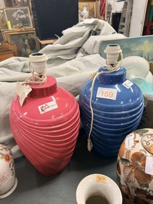 three vases sitting on a table next to each other