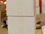 boxes stacked on top of each other with a bottle of wine on top of them