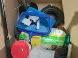 a box full of cleaning supplies and a broom in it