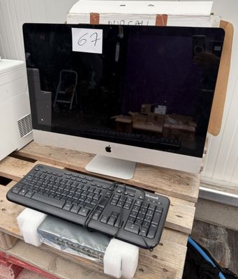 an image of a computer monitor and keyboard on a pallet