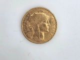 an image of a gold coin on a white surface