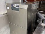 an image of a stainless steel dishwasher in a warehouse