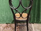 a chair that is sitting on a rug on the floor