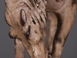 a statue of a horse that is standing on a table
