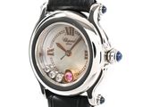 a close up of a wrist watch with a black leather strap