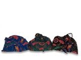 three hats are lined up on top of each other on a white surface