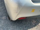 a close up of a car ' s rear end with a sticker on it