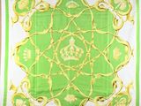 a green and white scarf with a gold design on it