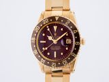 an image of a gold wrist watch with a purple dial