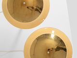 pair of mid century modern brass plated wall lights with glass shades