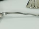 many spoons and spoon spoons sitting on a table