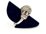 an image of a silver ring with pink and white stones on it