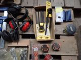 a box of tools on a pallet on the floor