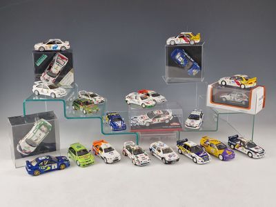 a lot of toy cars that are in a display case