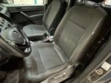 the interior of a car with a steering wheel and a steering control