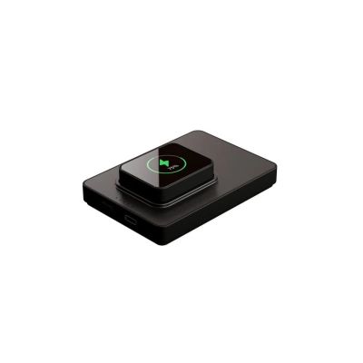 a black device that is sitting on a white surface
