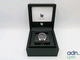 an image of a watch in a box on a white surface