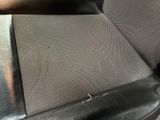 the seat of a car with a hole in the middle of it