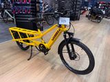 a yellow bike that is on display in a store