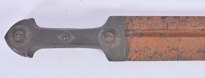 a knife that is laying on a white surface