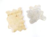 two pieces of paper that are sitting on a table