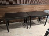 two tables that are sitting next to each other on the floor