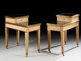 two tables with drawers on each side of them on a white surface