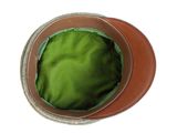 a brown hat with a green cover sitting on top of it