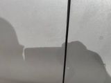 a shadow of a person on the side of a car