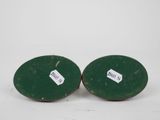 pair of antique green painted wooden candlesticks with labels on them