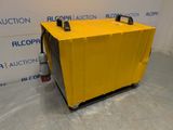 an air conditioner sitting on top of a cart in front of a wall