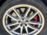 a close up of a car ' s tire on the road