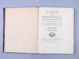an open book on a table with a blue background