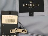 the label of a jacket is attached to the back of the jacket