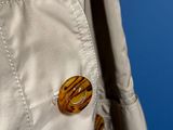 a close up of a jacket with a button on it