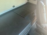 a seat in the back of a car with a seat belt