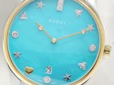 a close up of a wrist watch with a blue dial
