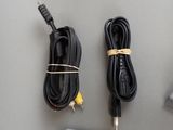 two cables and a remote control on a table