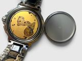 a close up of a watch with a watch face on it