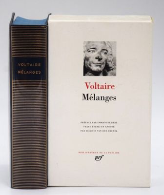 two books sitting next to each other on a white surface