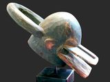 an image of a sculpture of a bird on a black base