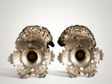 pair of silver vases on a white background with a gray background