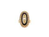 a black and gold ring with a diamond in the center